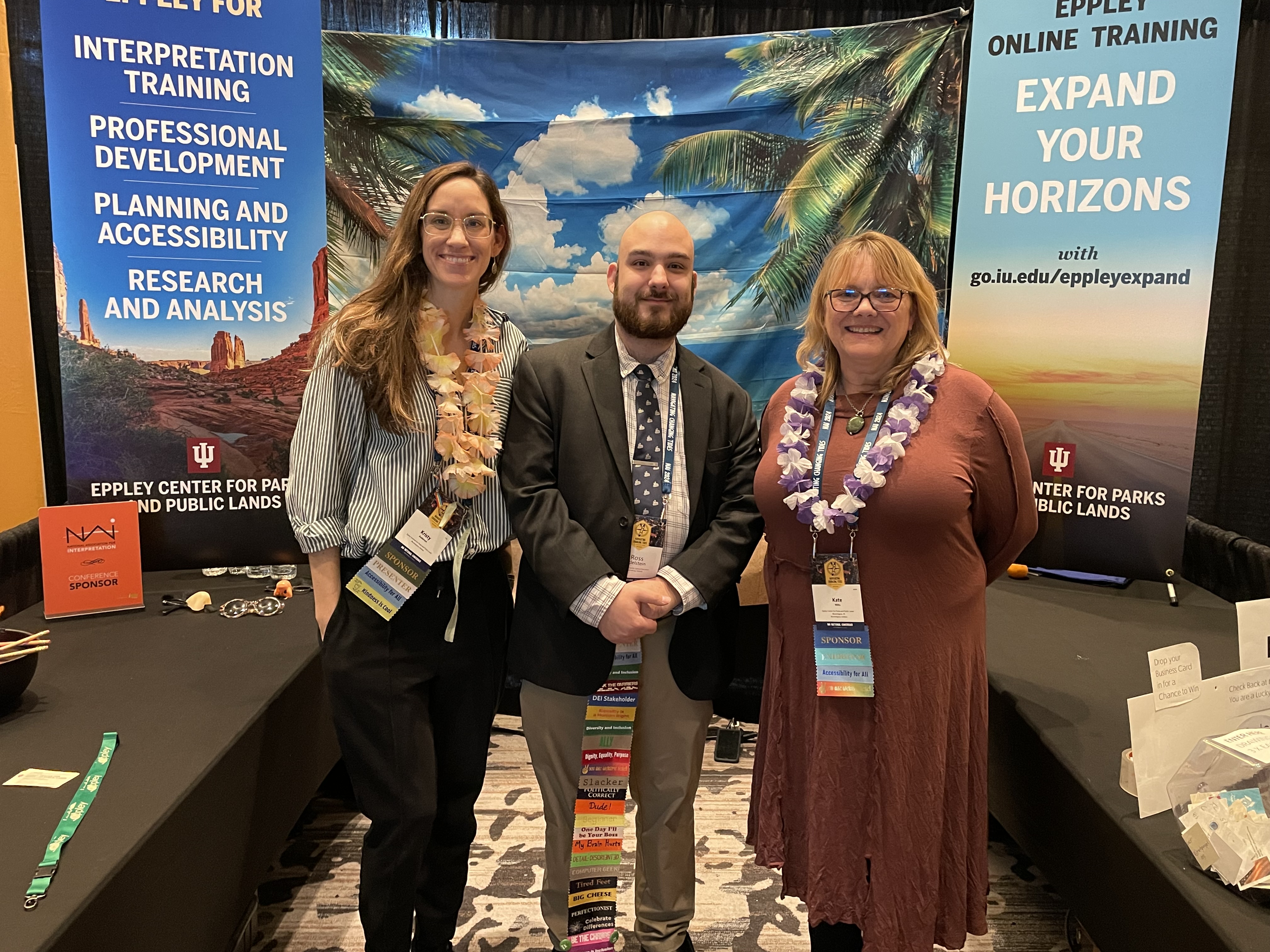 Kristy Anderson, Ross Edelstein, and Kate Wiltz standing in front of the Eppley booth at NAI